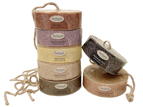 a stack of Herbaria Luffa Soaps