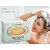 Herbaria Citrus Shampoo bar for thicker hair with a woman lathering her hair in the shower.