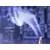 Wisps of blue-toned smoke curling upward from a lit herbal incense stick.