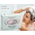 Herbaria Lavender Shampoo bar for finer hair with a woman lathering her hair in the shower.