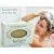 Herbaria Rosemary Mint Shampoo bar for thicker hair with a woman lathering her hair in the shower.