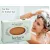 Herbaria Tea Tree Shampoo bar for thicker hair with a woman lathering her hair in the shower.