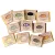 A group of Herbaria's 11 hotel-sized soaps spread out on a white background.
