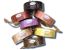 A group of Herbaria Luffa soaps on their side to show their labels.