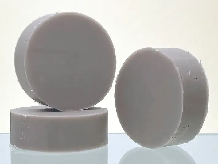 Handcrafted Herbaria plant-based conditioner bars with indigo and cocoa butter for natural hair care.