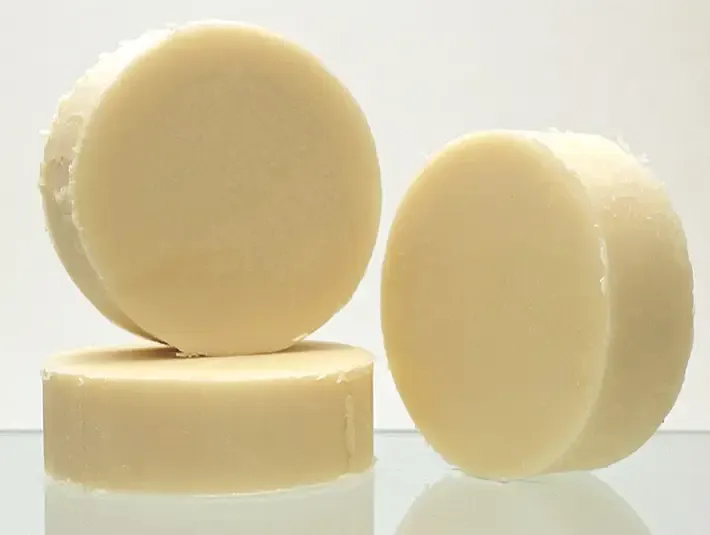 Unscented Herbaria natural conditioner bars stacked against a clean background, safe for all hair types including blonde.